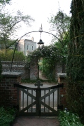 Gate from the Parish church Kilmeston with Manor house opposite